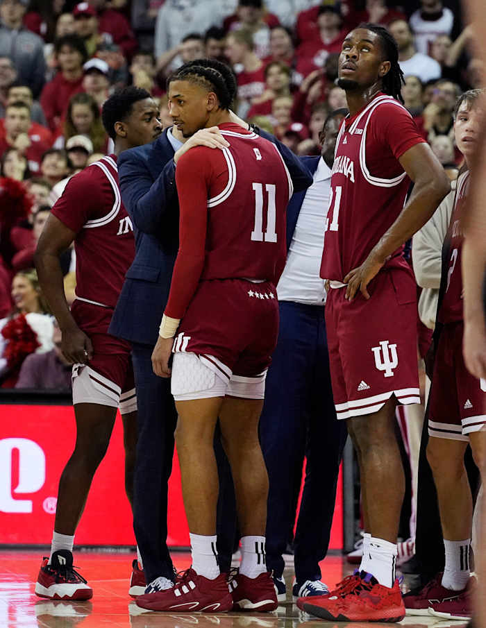 Indiana Hoosiers guard CJ Gunn (11) speaks with a coach as he is ejected for a flagrant 2 foul on Wisconsin Badgers guard Max Klesmit (11) during the second half of their game on Friday January 19, 2024 at the Kohl Center in Madison, Wis.